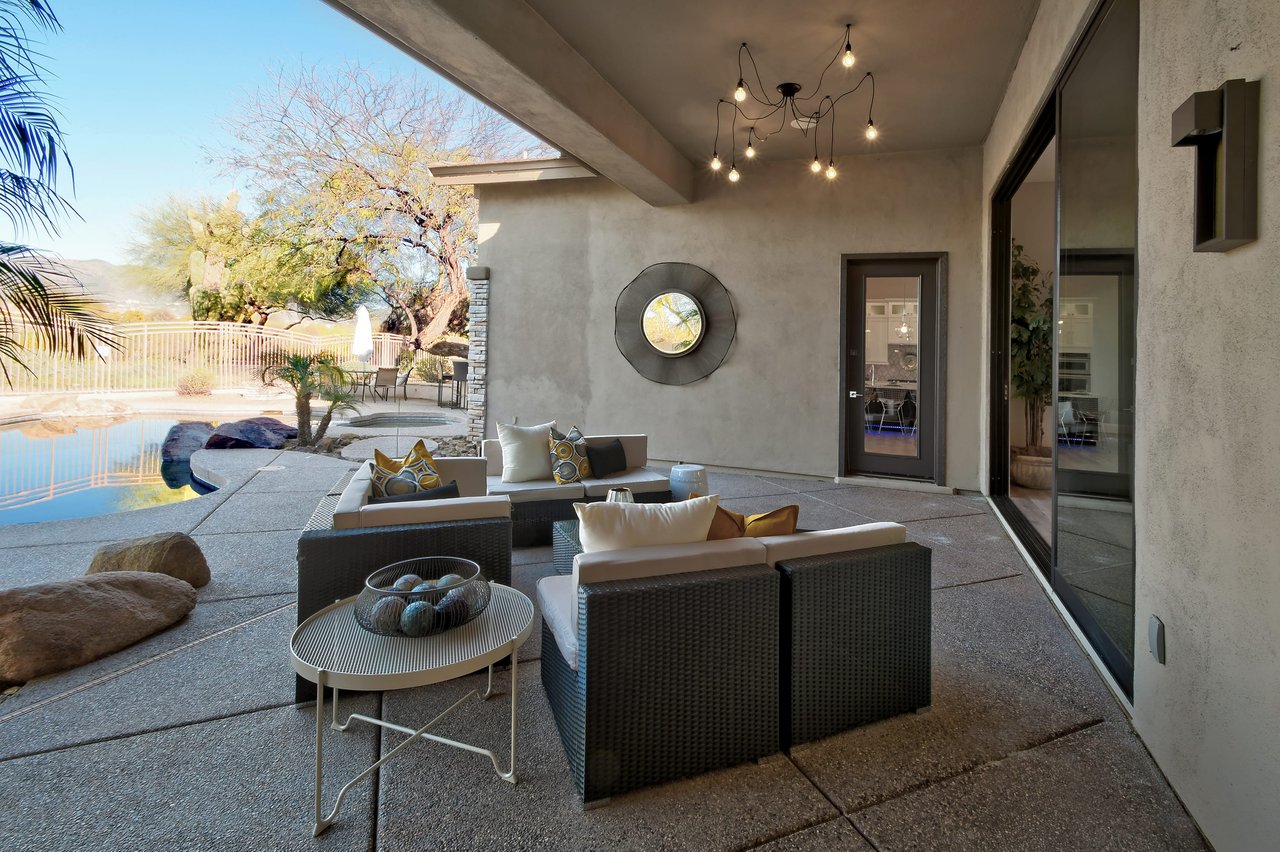 Luxury Scottsdale outdoor patio with designer furniture and pendant lighting
