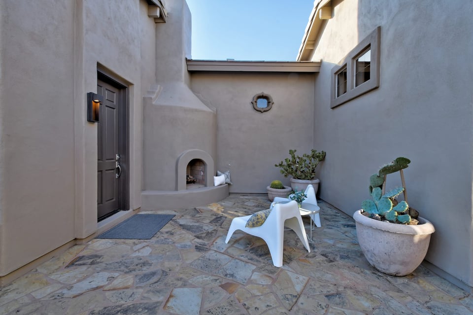 Scottsdale Arizona home exterior with Spanish-style courtyard and stone patio